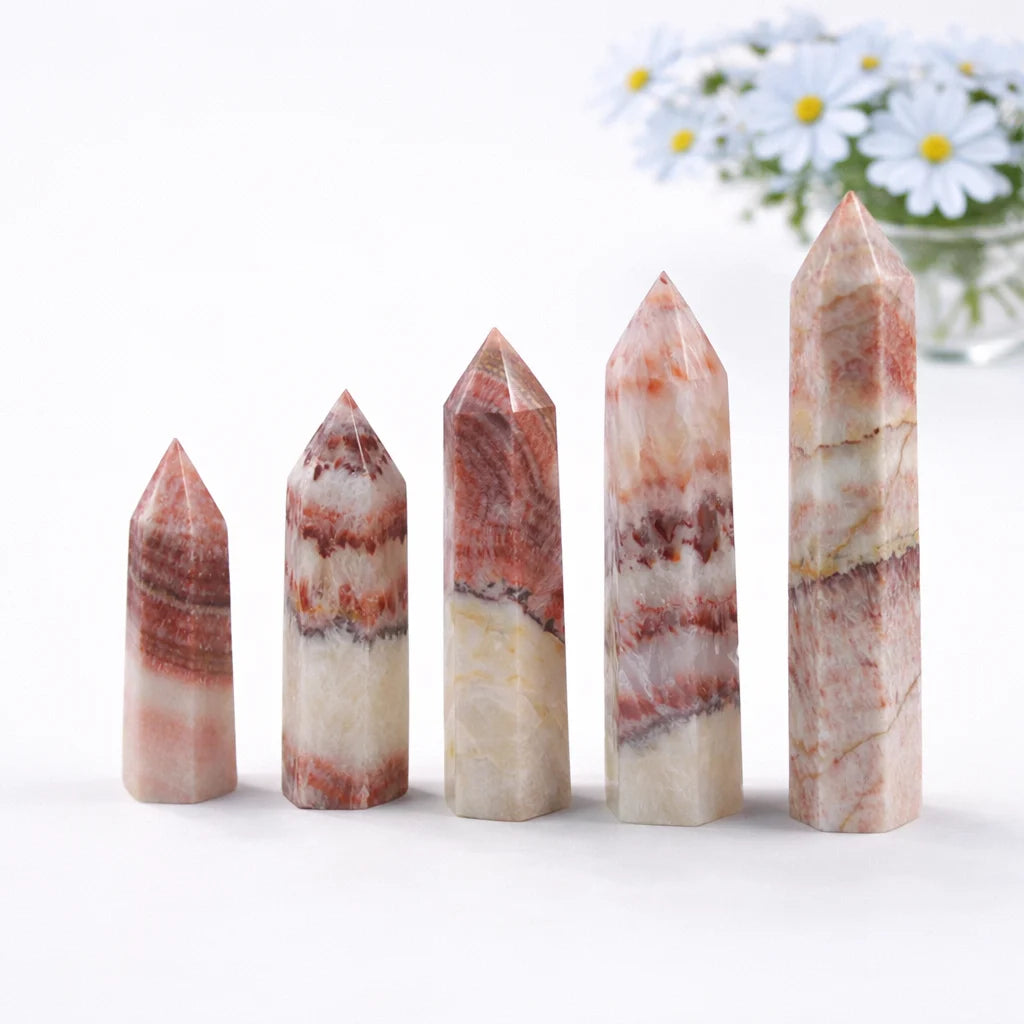 Dali jasper healing crystal tower with smooth finish and distinctive banded texture on white surface